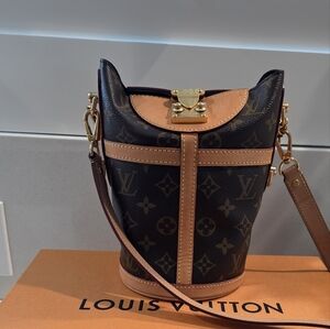  Louis Vuitton Monogram Canvas Duffle Bucket Bag with vachetta leather trim.